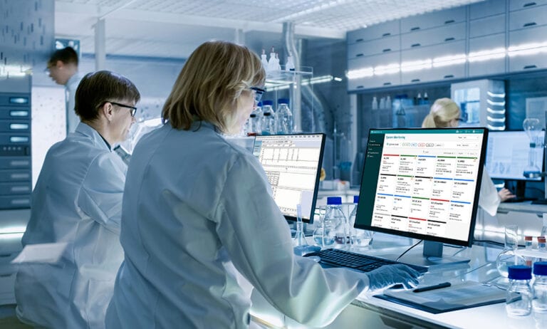 two scientists using empower and data intelligence on monitors full res presentation ready jpg