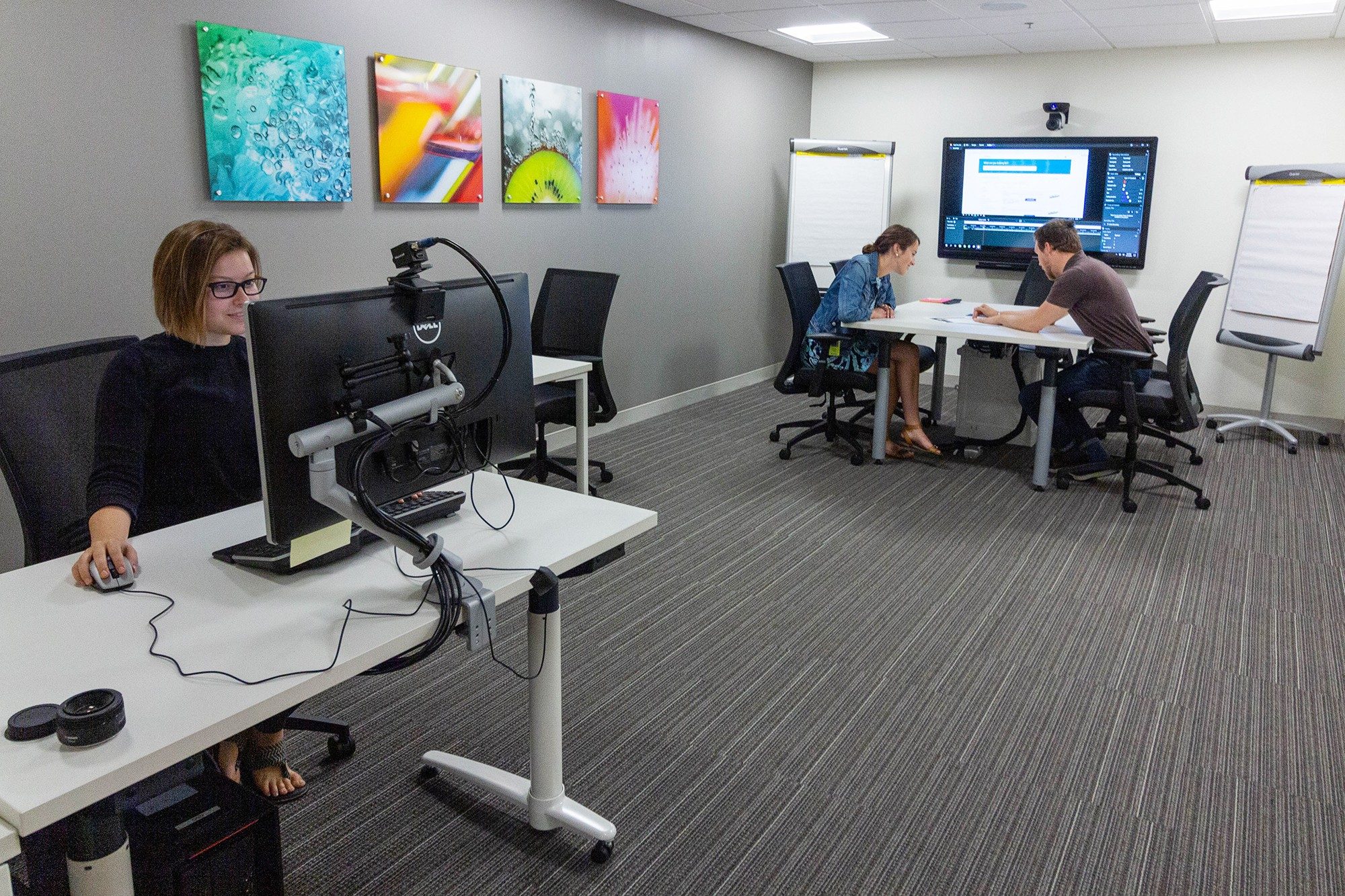 Three people in the Experience Design Center Digital Lab conducting a testing session