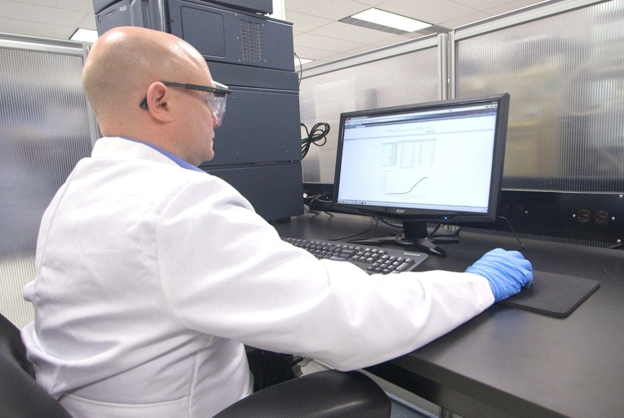 Waters lab ACQUITY UPLC I-Class System with scientist
