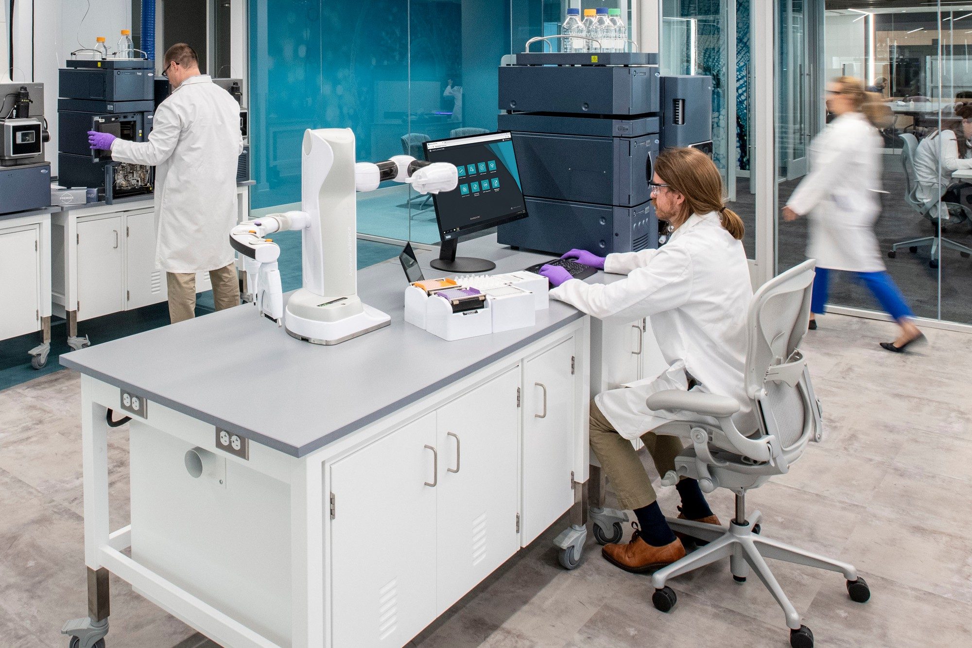 Scientists working in Waters Immerse laboratory