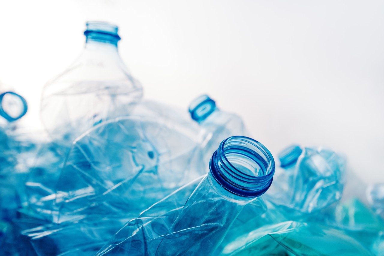 Crushed plastic bottles heap ready for recycling