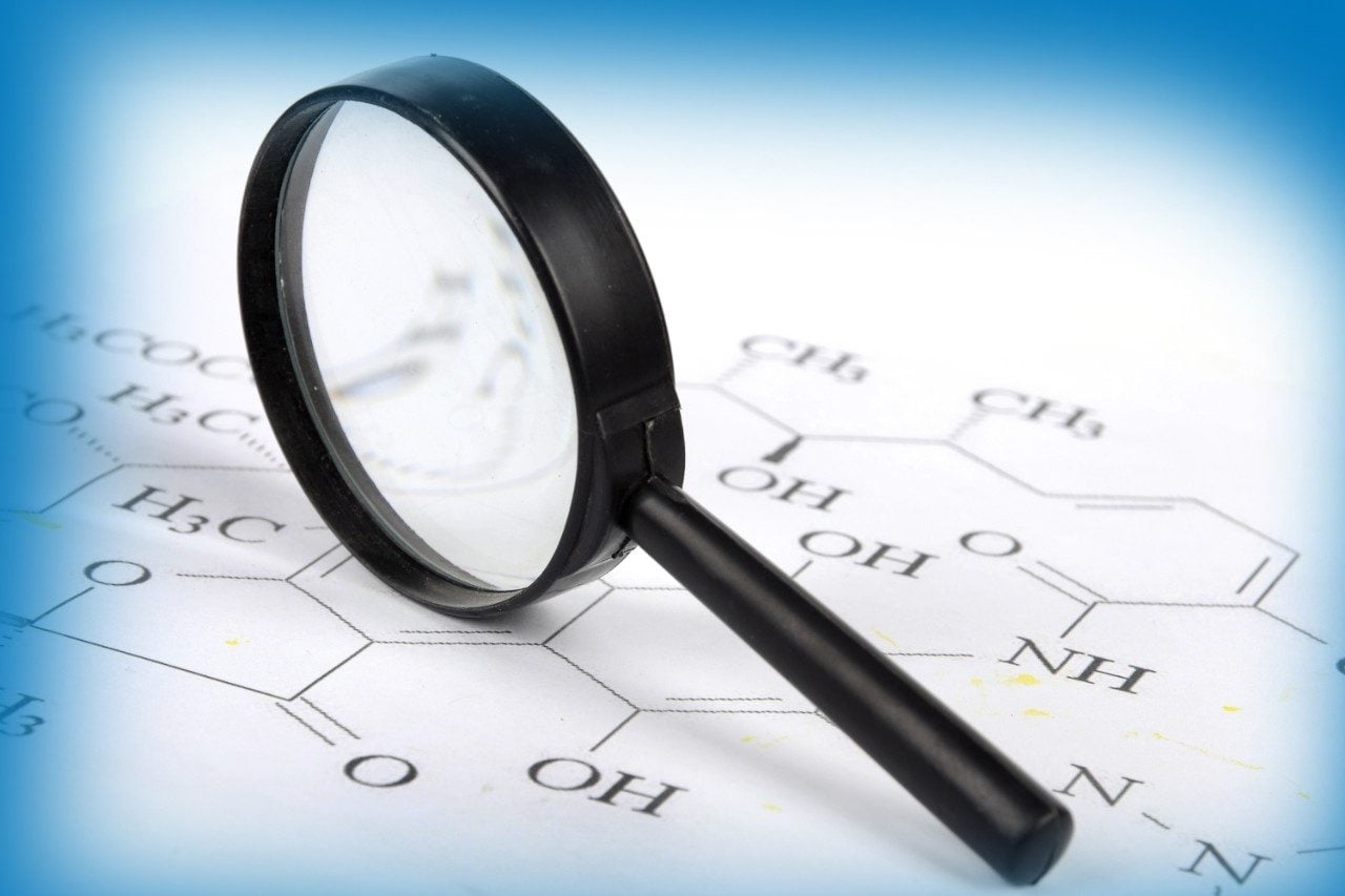 Magnifying glass on chemical structures