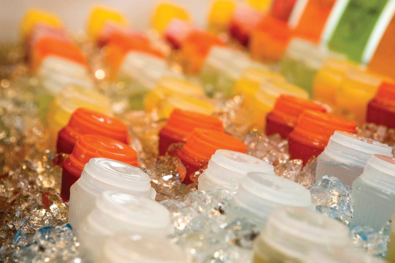 Rows of bottled juices or sports drinks
