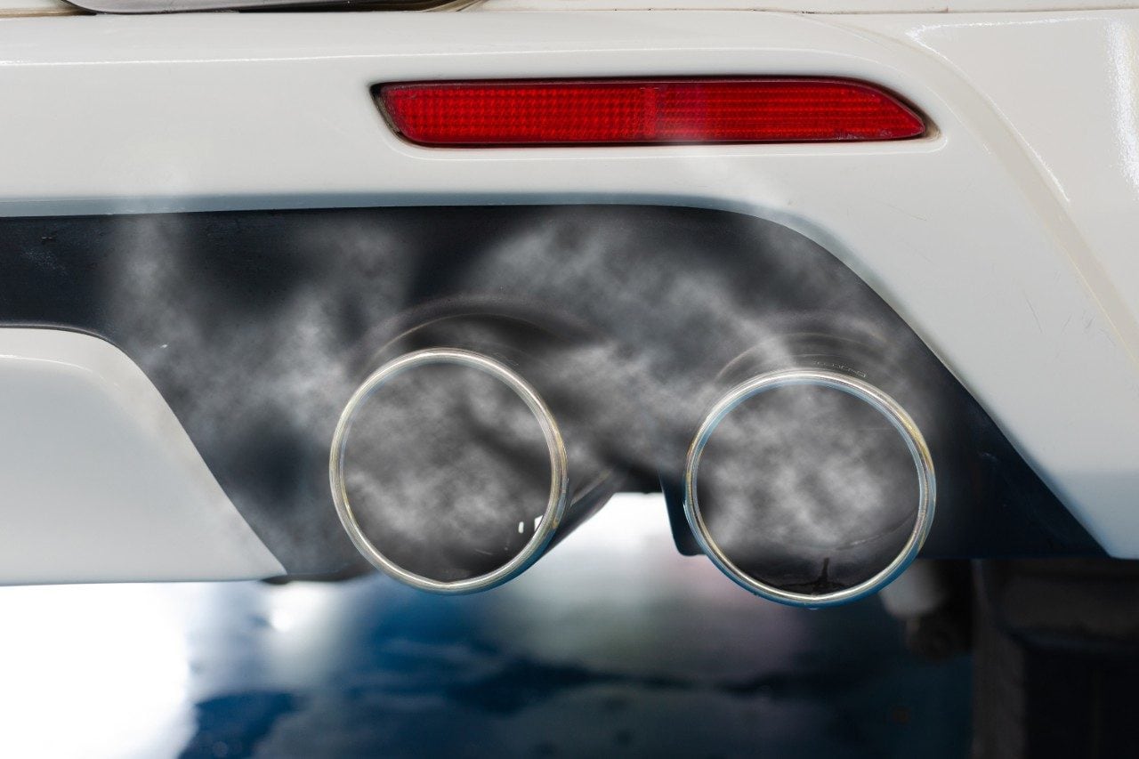 Car smog and air pollution from exhaust pipe