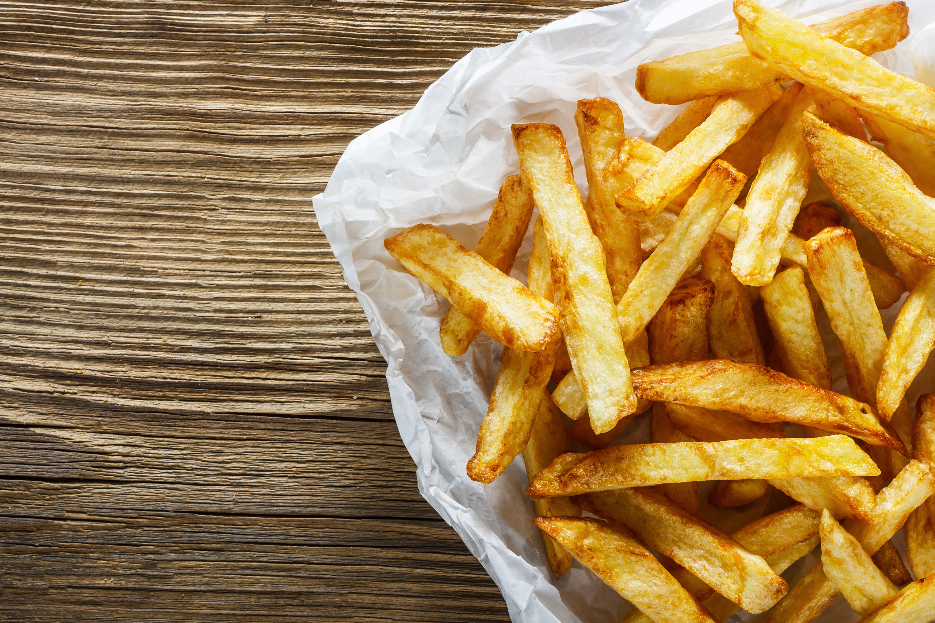 French fries in wax paper