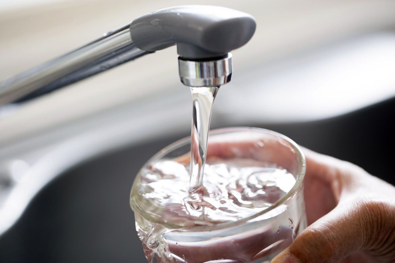 
Tap water flowing into glass