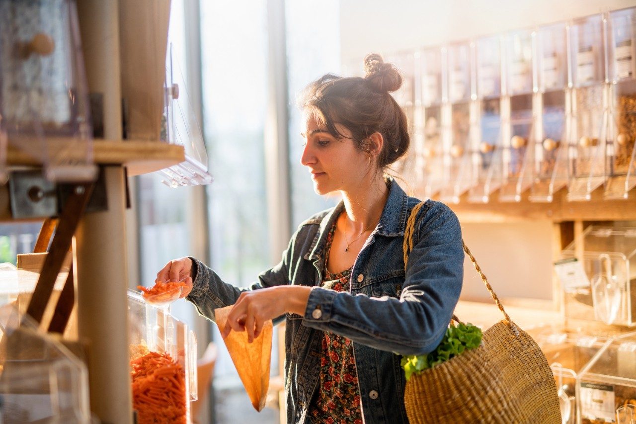 Woman shopping in a natural food bulk store