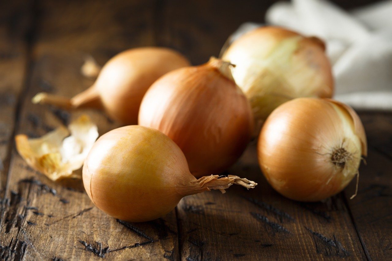 Raw onions on a table