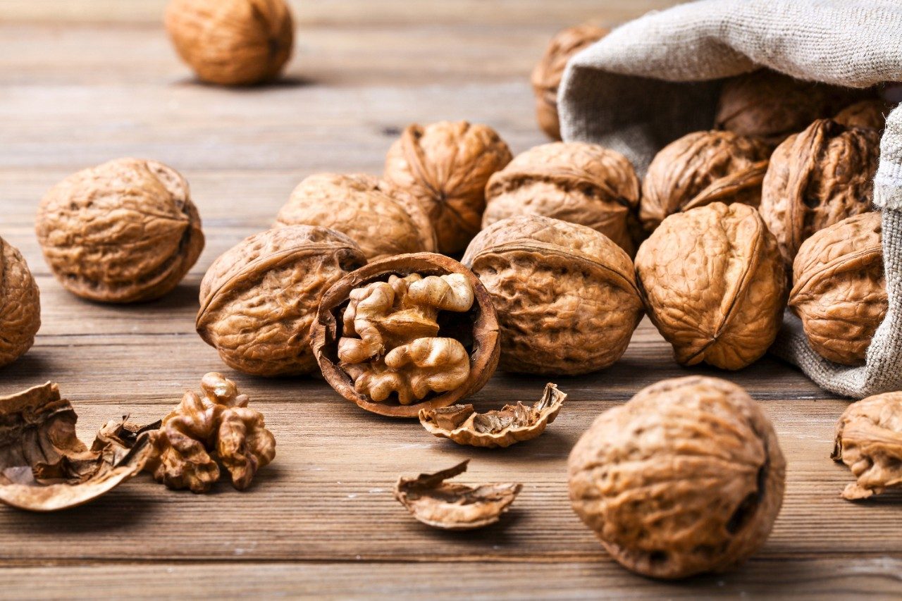 Walnuts in shells and cracked open