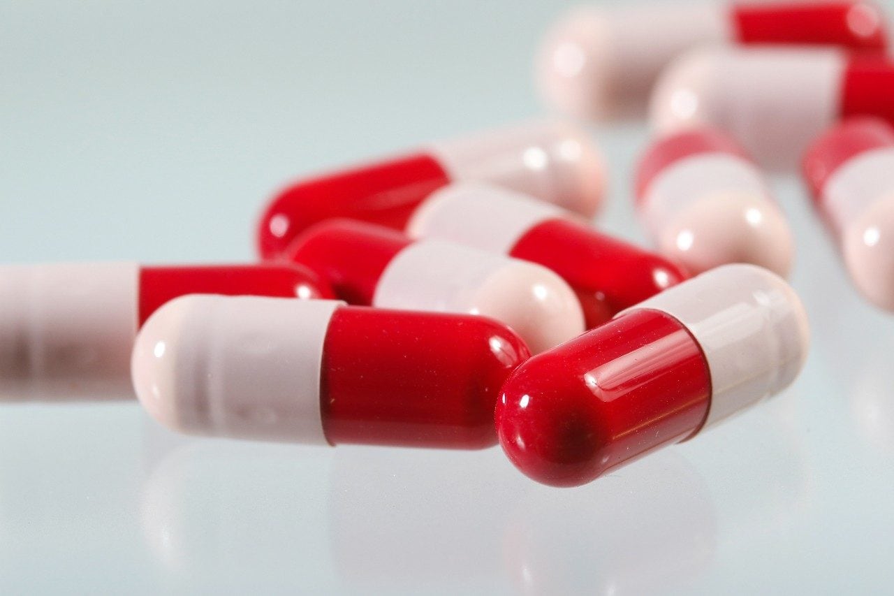 Red and white antibiotic capsules
