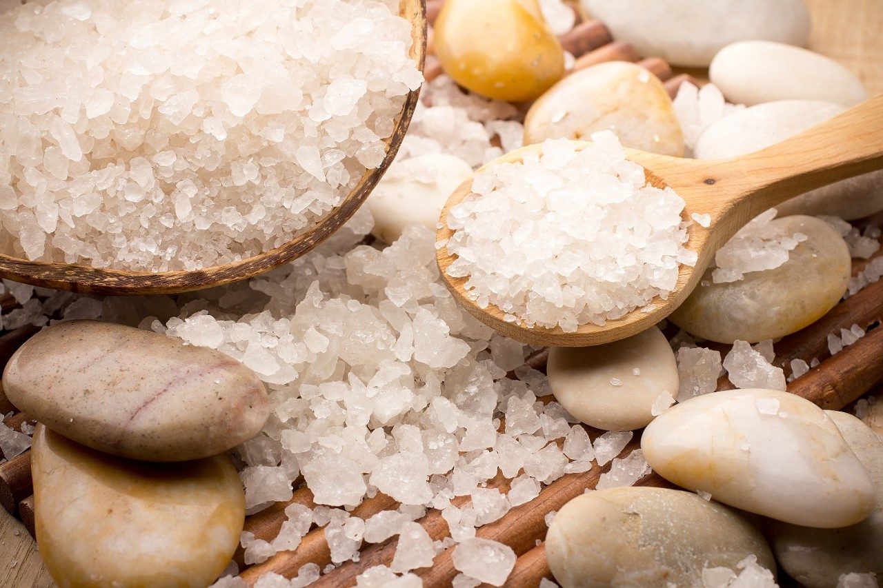 Bath salts in spoon and bowl