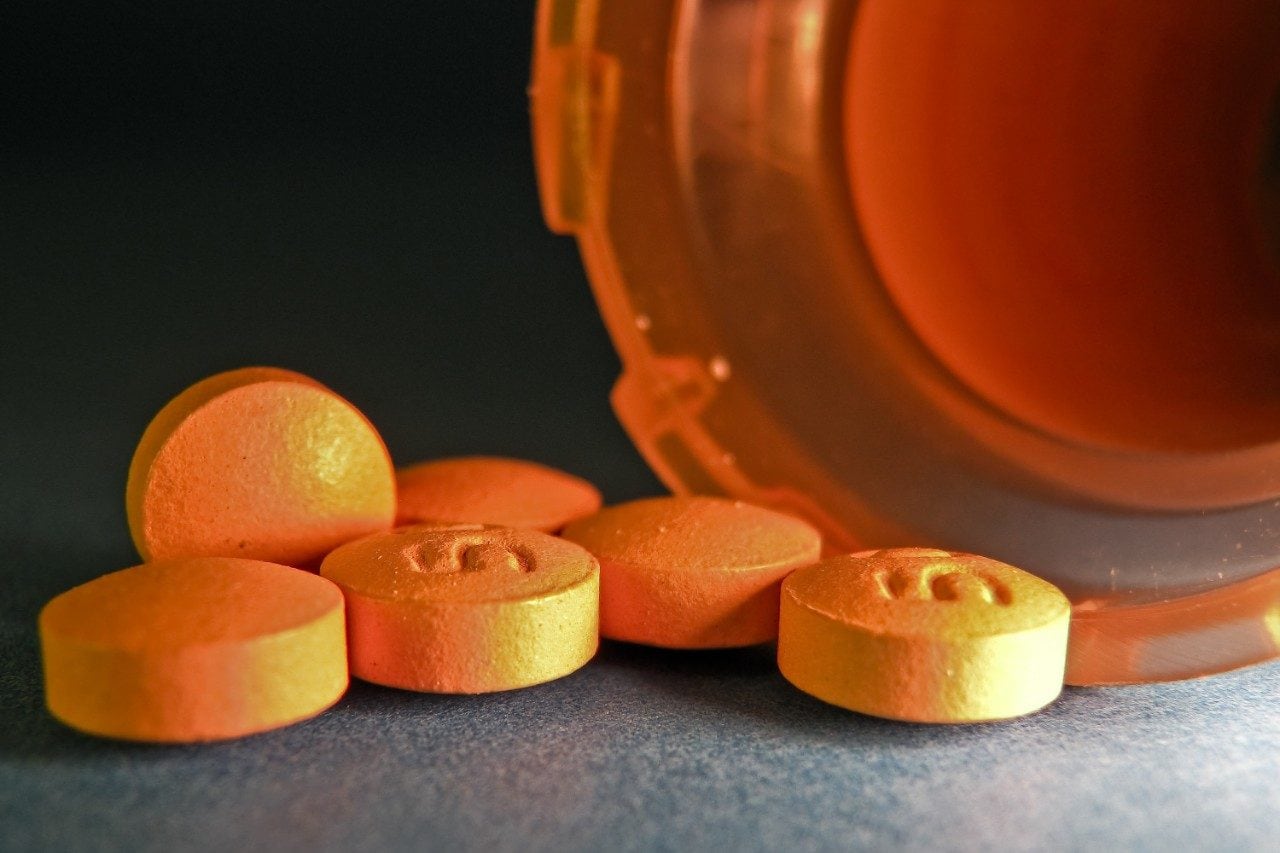Orange tablets and pill bottle