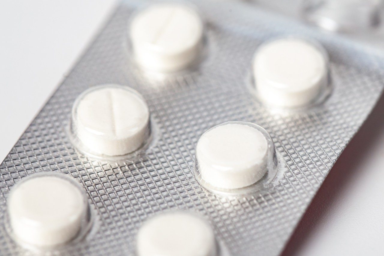 Packs of white pills packed in blisters