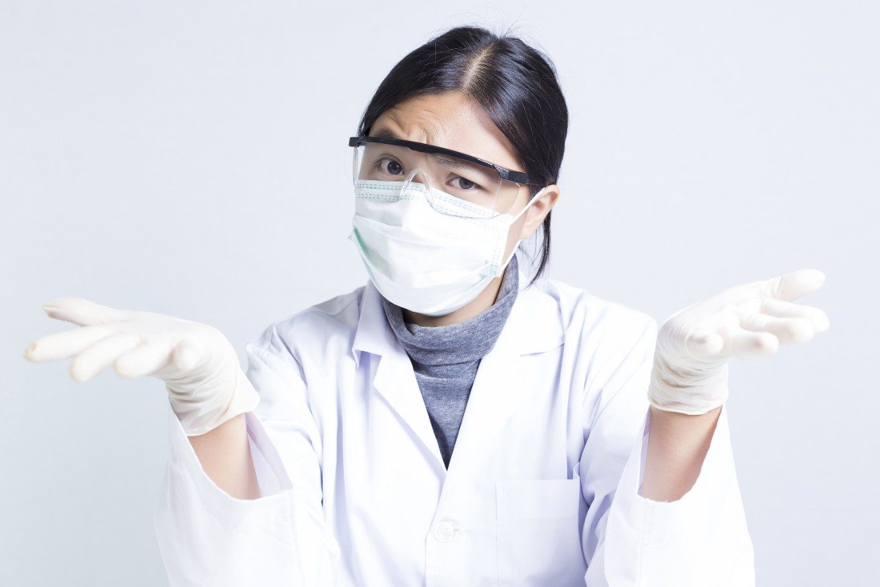 Confused female scientist researcher