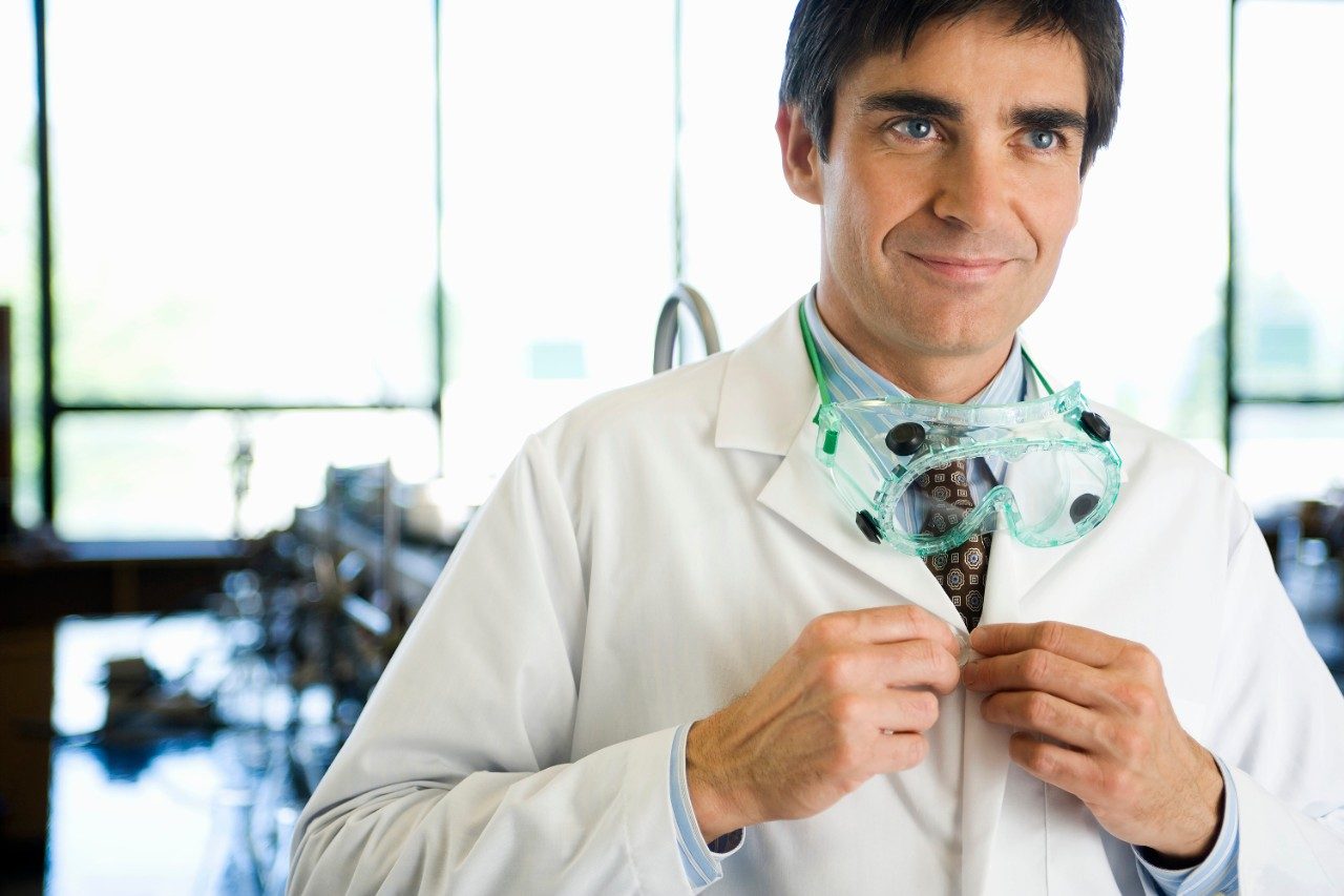 Scientist wearing lab coat and goggles