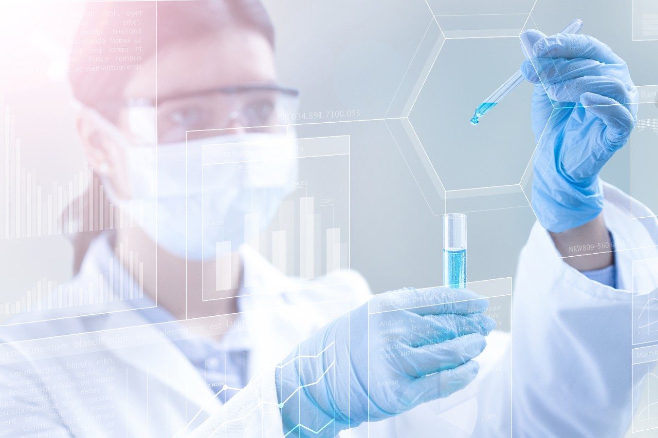 Scientist holding a test tube in a scientific background