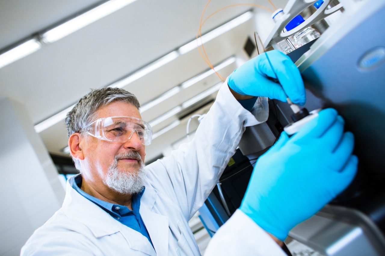 Researcher doing scientific research in a lab using Waters Mass Spectrometry instruments
