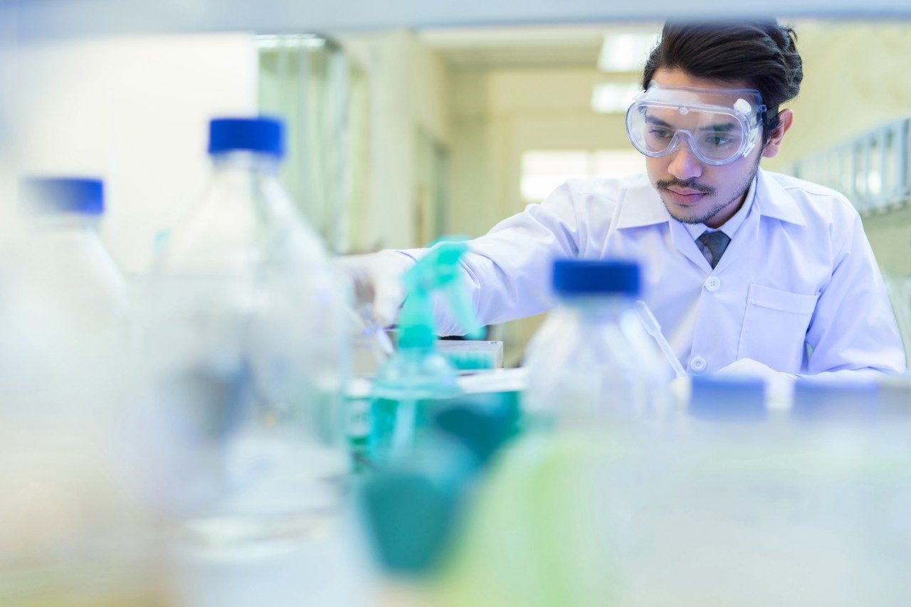 Scientist in the laboratory working at lab with test tube
